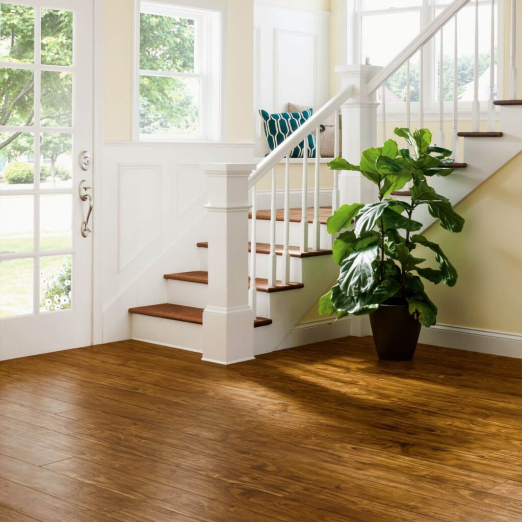 Entryway with warm brown vinyl plank flooring