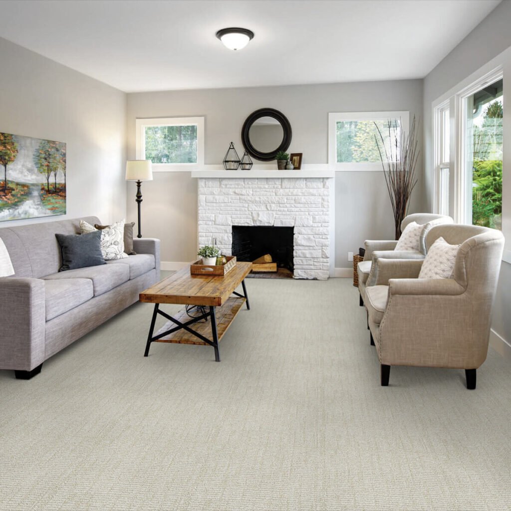 Light cream carpet in living room with fireplace
