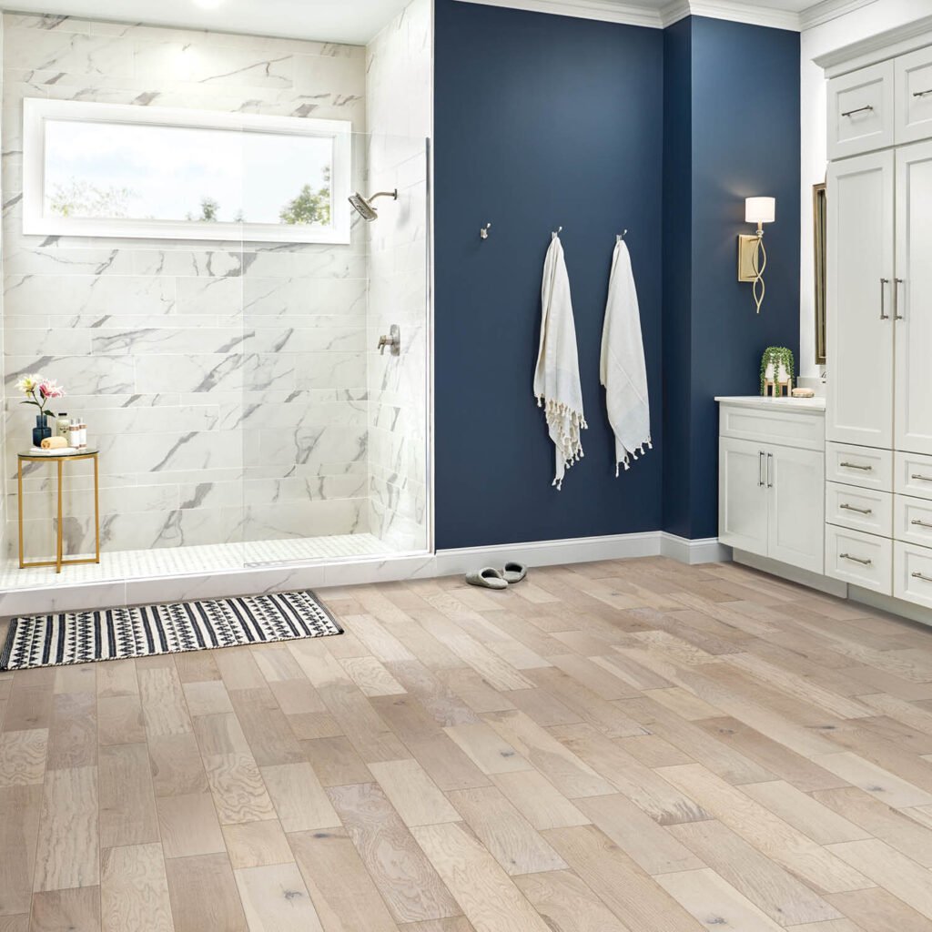 Light wood laminate flooring in bathroom