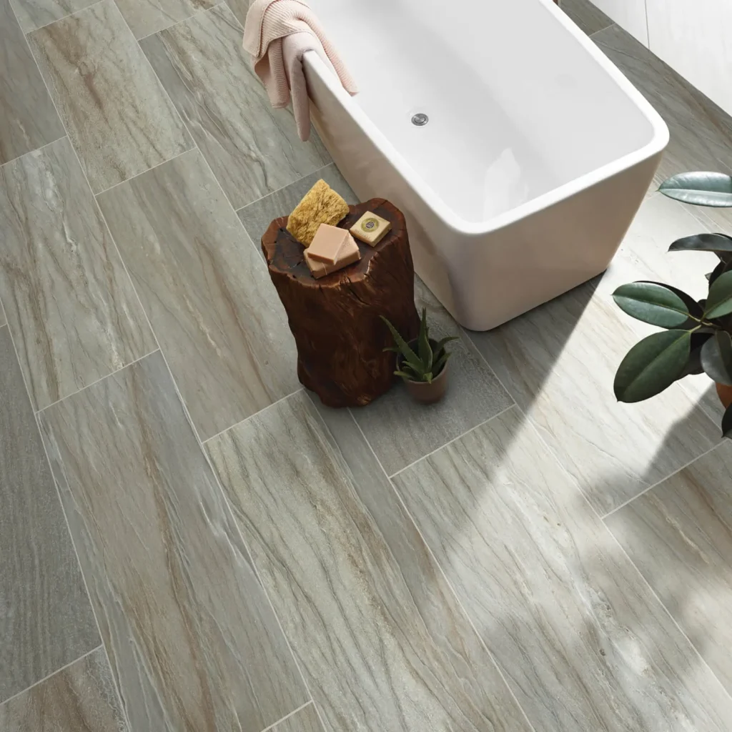 Light wood-look tile flooring with freestanding bathtub
